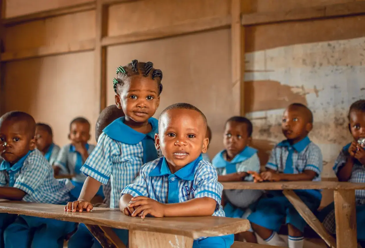 Pupils in school uniform at their desks in a Nigerian classroom